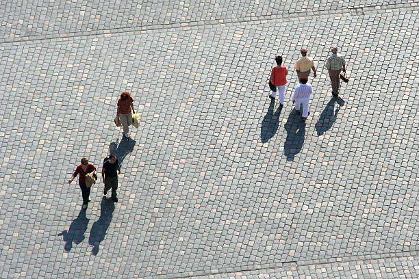 People walking, alone, in a group