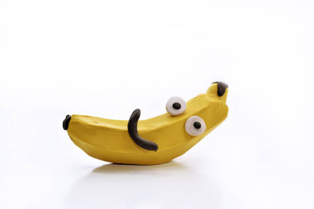 Banana from play clay. Isolated on white background.