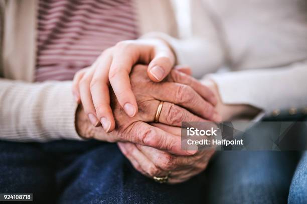 Hands Of Teenage Girl And Her Grandmother At Home Stock Photo - Download Image Now - Senior Adult, Hand, Old