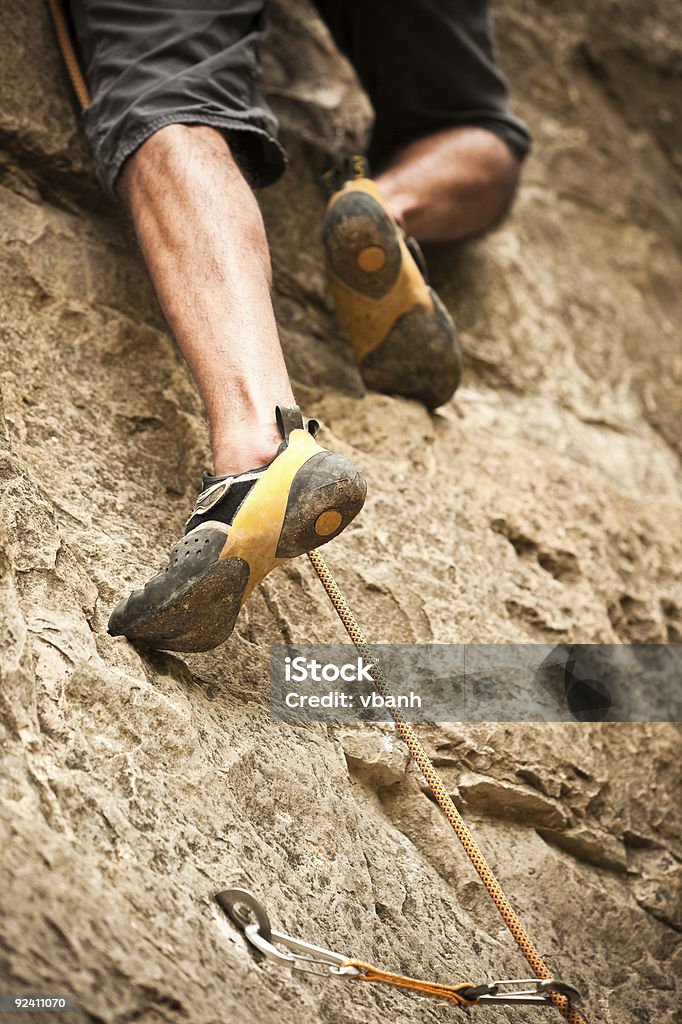 Rock Climber's Feet Scaling Wall  Rock Boot Stock Photo