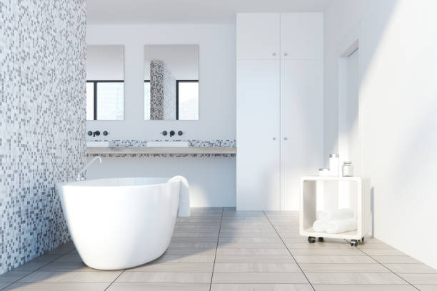 istock Gray tile bathroom, white tub 924111140