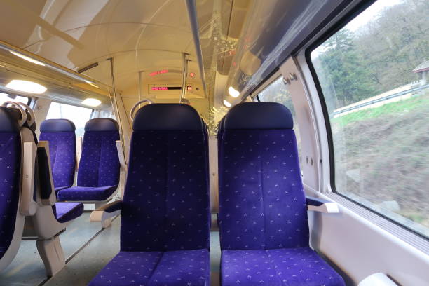 Inside a French regional train Lyon, France – February 18, 2018: Photography showing the inside of a regional French train going from Lyon to Grenoble.  The photography was taken at the train station of Lyon, France. train interior stock pictures, royalty-free photos & images