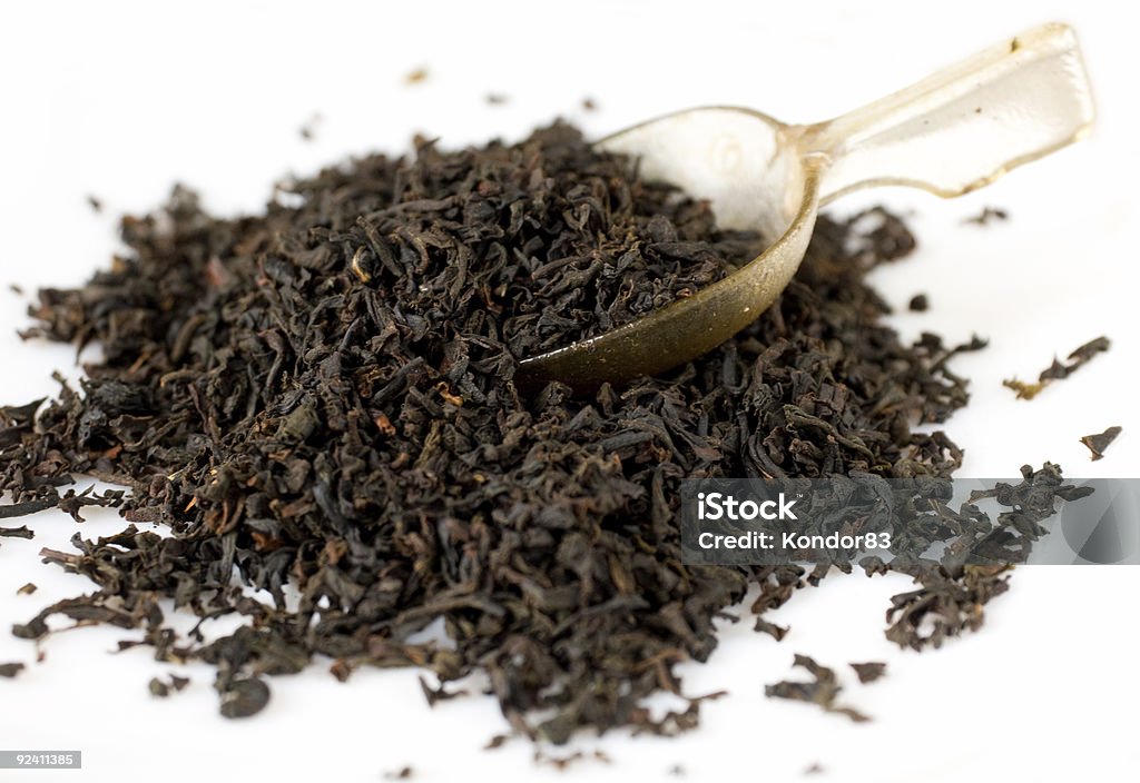 Black english tea with spoon  Dried Tea Leaves Stock Photo