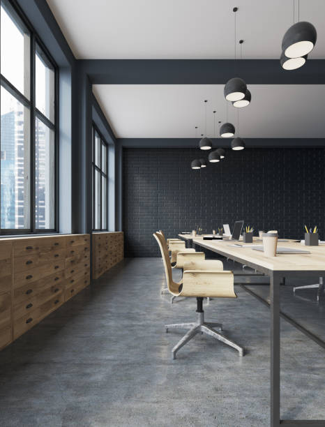 istock Black brick office, wooden tables 924114218