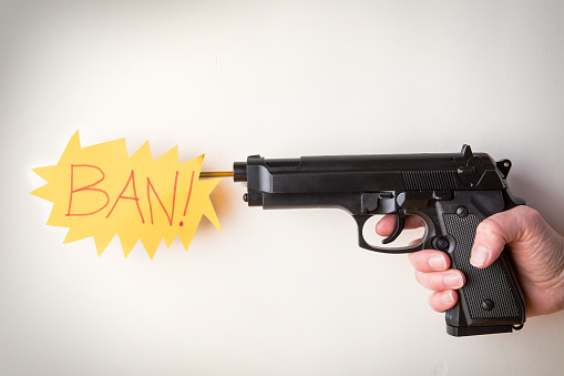 A conceptual image of a gun that says BAN! instead of BANG!