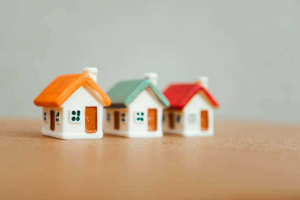 istock Miniature colorful orange green red house 924115180