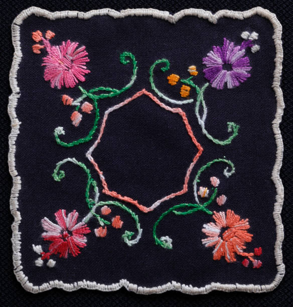 istock Flower embroidery on black textile 924121418