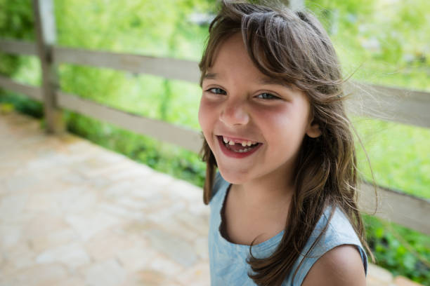 Smiling toothless little girl
