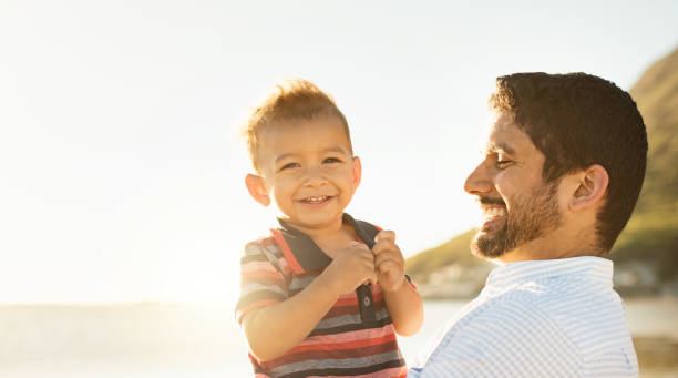 istock Father and son having fun and enjoying spending time together outdoors 924124898