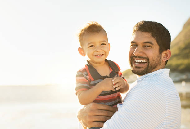 istock Father and son having fun and enjoying spending time together outdoors 924134882