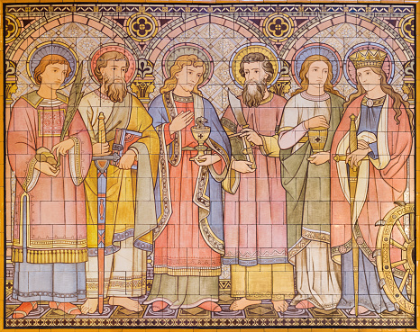 London -  The tiled mosaic of Apostles and saints in church All Saints designed by Butterfield and painted by Alexander Gibbs (1873).