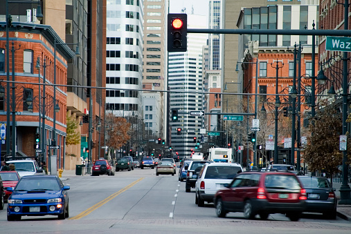 Picture is of a busy downtown Denver street taken from the Lodo Shopping area.