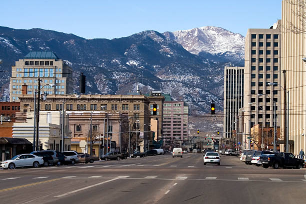 Pikes Peak Avenue Colorado Springs Downtown Colorado Springs Colorado looking west from Pikes Peak Avenue towards Pikes Peak and the Rocky Mountains. colorado springs stock pictures, royalty-free photos & images