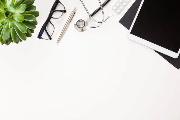 istock Digital Tablet With Stethoscope And Eyeglasses By Plant On Table 924149302