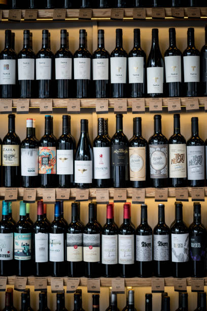 Wine bottles on shelves at a winery