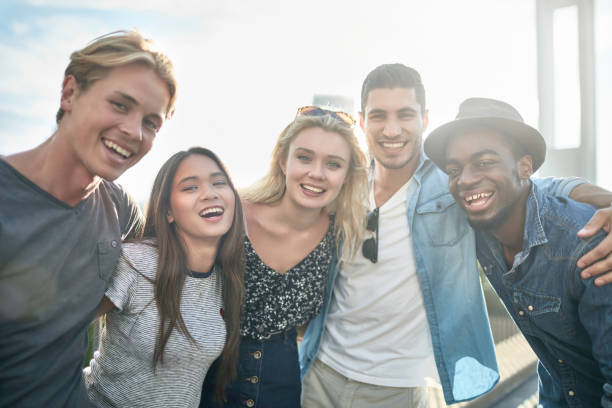 istock Friends with arms around standing in city 924150038