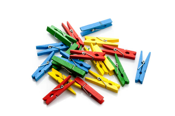 istock Multi colored clothes pins heap isolated on white background 924153036