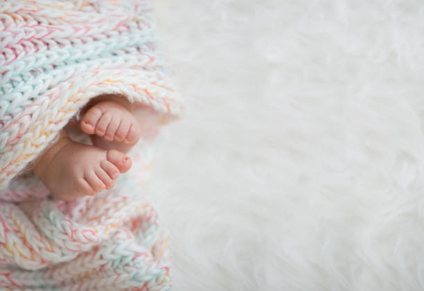 istock baby feet in blanket, copy space. selected focus 924159214