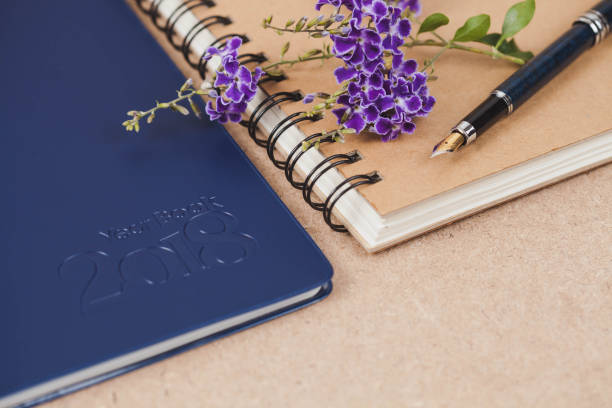 istock personal organizer or planner with fountain pen on wood table. 924159736