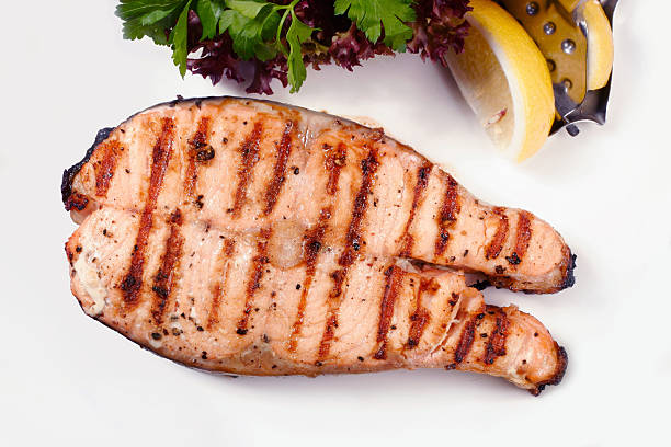 istock Grilled salmon steak with salad and lemon 92416298