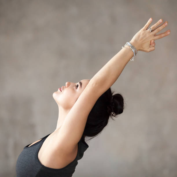 istock Young woman doing Virabhadrasana 1 exercise 924163354