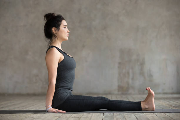 istock Young woman in Dandasana pose 924163488