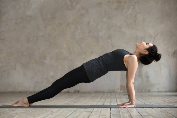 istock Young woman in Upward Plank pose 924163492