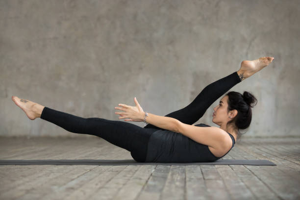 istock Young woman doing alternate leg stretch exercise 924163590
