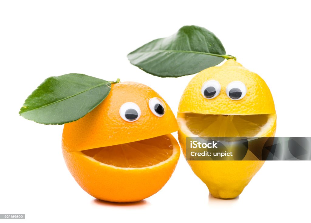 Laughing orange and lemon with leaf isolated on white background real edible fruits isolated on white background , no artificial ingredients used Fruit Stock Photo