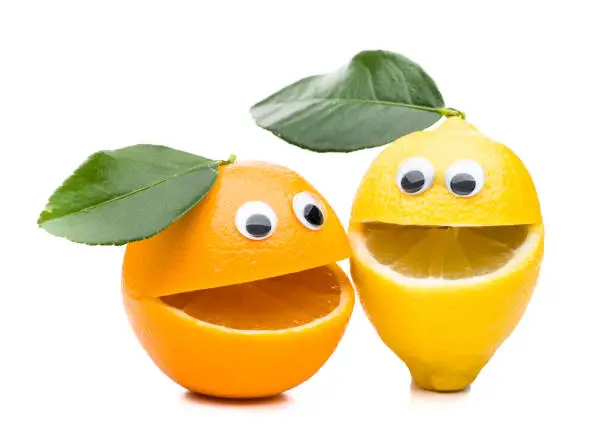 Photo of Laughing orange and lemon with leaf isolated on white background