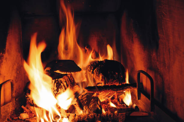 istock Close up of burning firewood in the fireplace. 924169882