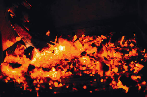 istock Hot red coals from firewood in a fireplace 924169988
