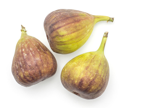 Three figs top view isolated on white background fresh ripe purple green