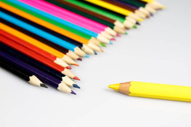 Color image depicting a close up macro abstract view of a collection of colored pencils.