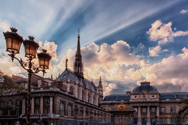 Paris city at evening Sainte Chapelle church viewed from the entrance of the law court in center of Paris sainte chapelle stock pictures, royalty-free photos & images