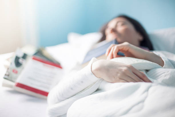 istock Woman sleeps with books 924185826