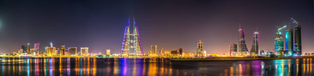 Skyline of Manama dominated by the World Trade Center Building. Bahrain Skyline of Manama dominated by the World Trade Center Building. The capital of Bahrain manama stock pictures, royalty-free photos & images