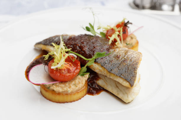 istock Sea bass fillet on white plate 924204926