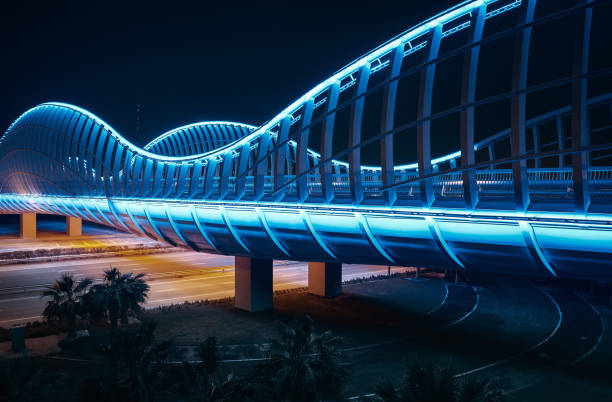 blue bridge at night, dubai - street light street bridge illuminated imagens e fotografias de stock