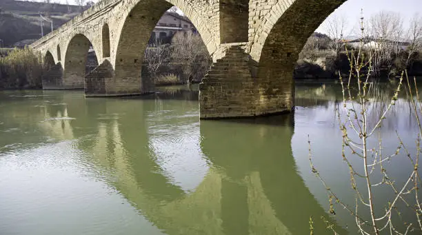 Stone bridge over river, natural landscape, construction