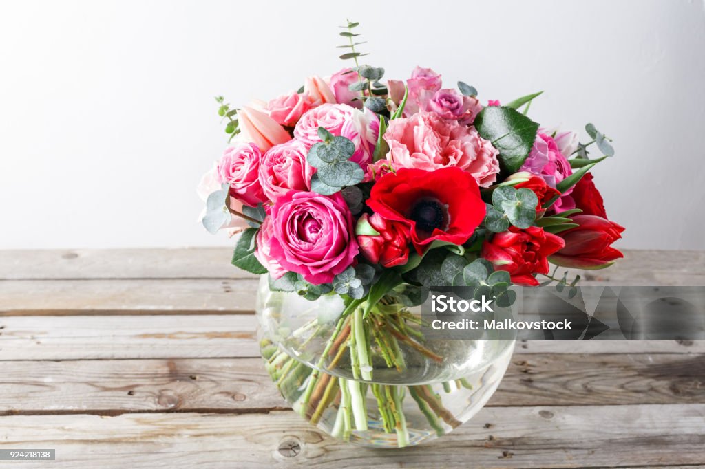 Bouquet of pink roses and Other colors flowers on wooden background, copy space. Bouquet of pink roses and Other colors flowers on wooden background, copy space Anemone Flower Stock Photo
