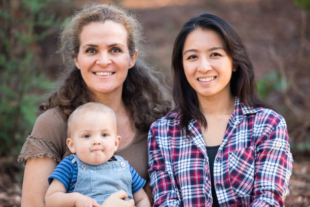 istock Women and a baby boy posing smiling 924218290
