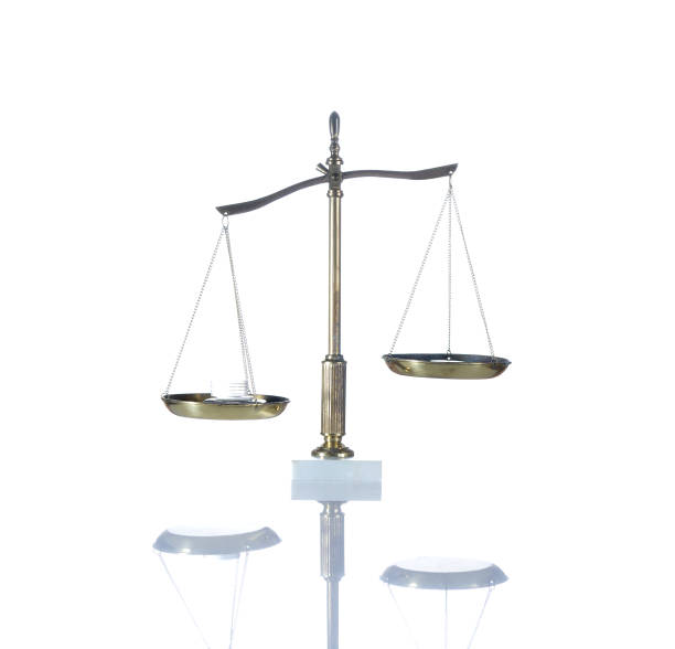 istock Balancing Silver Coins and an Empty Weigh Scale. Ready for your concept. 924221918