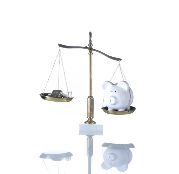 istock Balancing Piggy Bank and Silver Coins 924224862