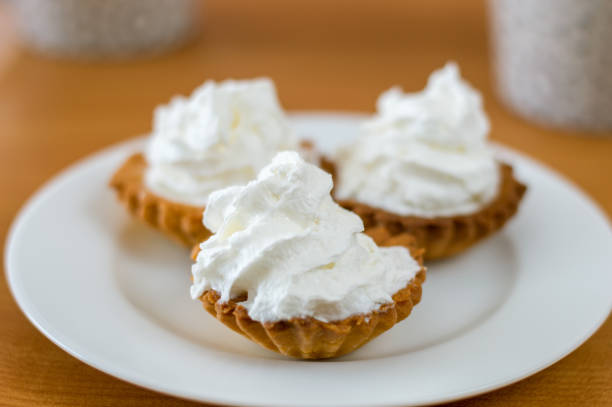 istock Polish babeczki cake with whipped cream on white plate. 924231450