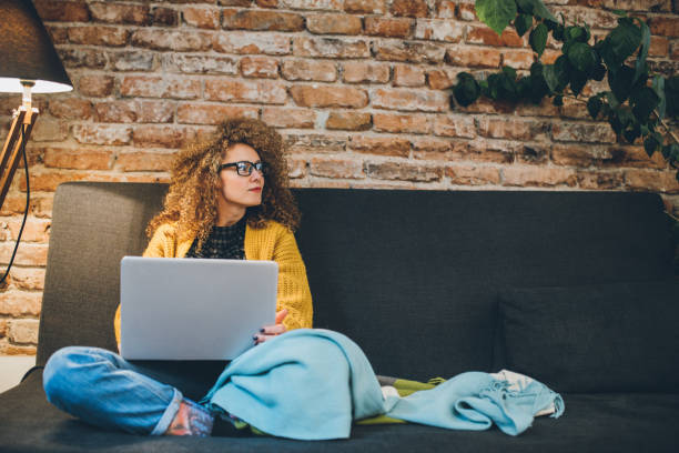 istock Woman using a laptop at home 924236286