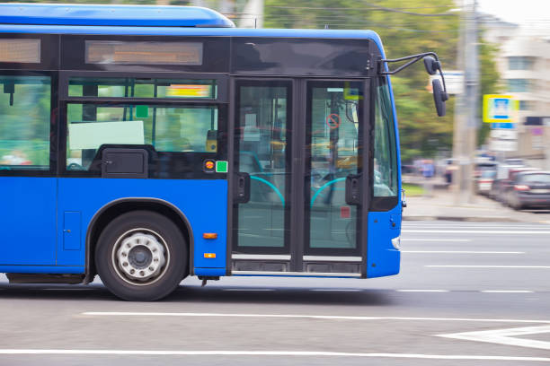 istock bus goes along street 924246420