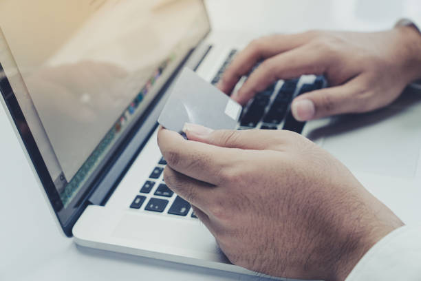 istock Young businessman use Credit Card to  Shopping Online with Computer Laptop 924253832