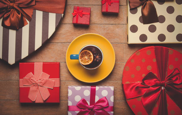 istock Cup of tea with lemon and holiday boxes 924253852
