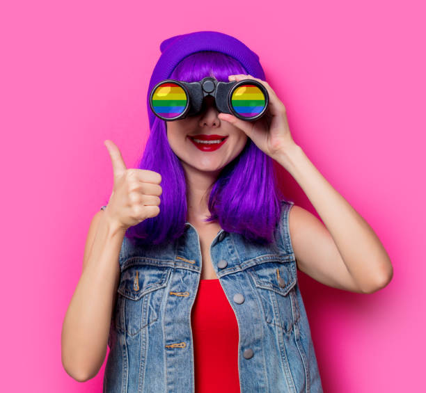 istock Girl with purple hair and with binoculars 924253904